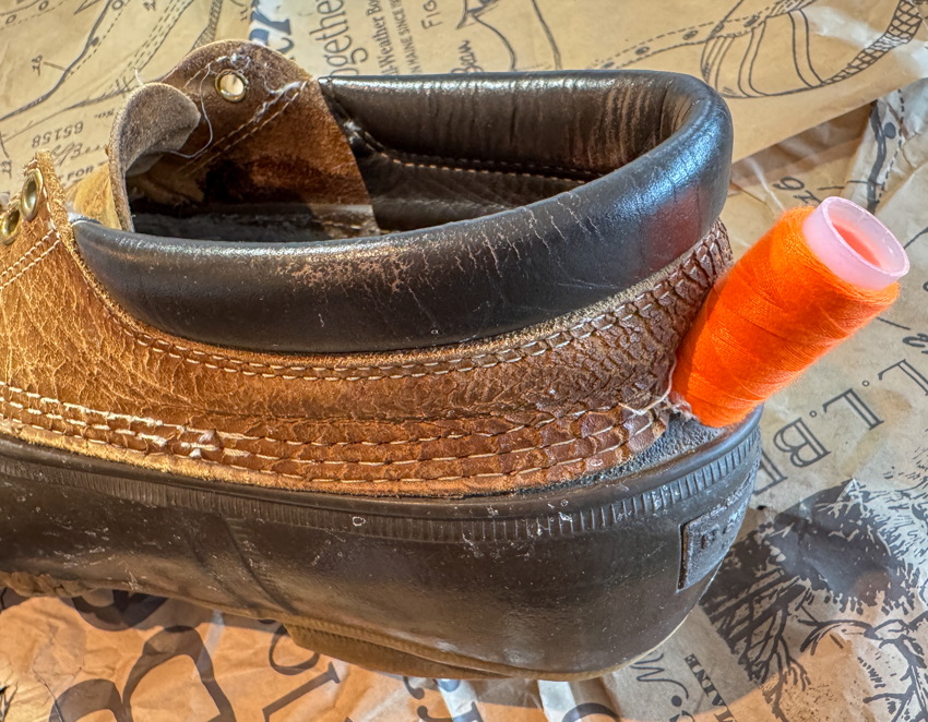 Duckboot with purple crochet needle pushed all the way through the heel